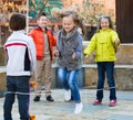 Girl jumping while jump rope game with friends Royalty Free Stock Photo