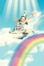 Girl jumping over rainbow Royalty Free Stock Photo