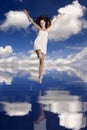 Girl jumping over the water Royalty Free Stock Photo