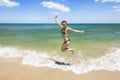 Girl jumping and splashing in the waves of the sea Royalty Free Stock Photo