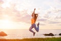 girl jumping at sunset against the background of the sea Royalty Free Stock Photo