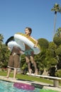 Girl Jumping In Swimming Pool Royalty Free Stock Photo