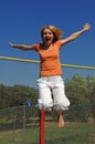 Girl Jumping on Trampoline Royalty Free Stock Photo