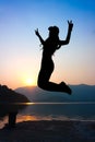 Girl jumping with V sign Royalty Free Stock Photo