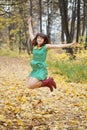 Girl jumps in autumn