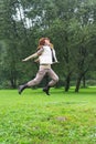 The girl jumps on a grass Royalty Free Stock Photo