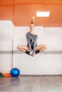 Girl jumps in the gym. The concept of sport, dance and a healthy