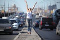 Girl jumps on highway middle