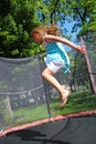 Girl jumps on the trampoline