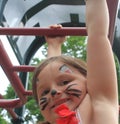 Girl on jungle gym at playground Royalty Free Stock Photo