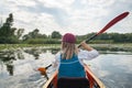 Girl in a kayak on a river Royalty Free Stock Photo