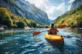 Girl in kayak sails mountain river. Whitewater kayaking, extreme sport rafting