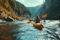 Girl in kayak sails mountain river. Whitewater kayaking, extreme sport rafting