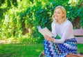 Girl keen on book keep reading. Reading literature as hobby. Woman blonde take break relaxing in park reading book. Girl