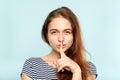 Girl keep secret mystery finger on lips Royalty Free Stock Photo