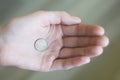 Girl keeping one euro cent coin on palm Royalty Free Stock Photo