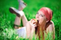 Girl in kerchief with apple