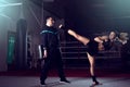 Girl kicking back leg during kickboxing practice Royalty Free Stock Photo