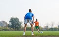 Girl kicking soccer ball