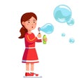 Girl kid blowing bubbles holding bottle with soap