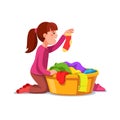 Girl kid doing housework chores sorting laundry