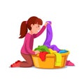 Girl kid doing housework chores sorting laundry Royalty Free Stock Photo