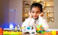 Girl Kid got upset due to broken DIY robotic experiment - concpet of Childhood brain development, Learning scientfic experiment Royalty Free Stock Photo