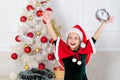 Girl kid santa hat costume with clock excited happy face counting time to new year. Last minute new years eve plans that Royalty Free Stock Photo