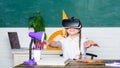 Girl kid study in virtual school. Virtual education. Child cute pupil wear hmd vr glasses. Virtual teaching. Studying in