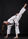 Girl in kimono exercising karate kata Royalty Free Stock Photo