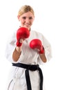 Girl in kimono for karate and boxing gloves Royalty Free Stock Photo