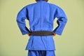 A girl in blue judo gi.