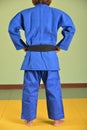 A girl in blue judo gi.