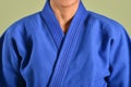 A girl in blue judo gi.