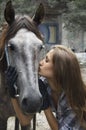 A girl kisses her horse Royalty Free Stock Photo