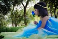 Girl kissin blue rose Royalty Free Stock Photo