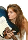 Girl kissing a guitar Royalty Free Stock Photo