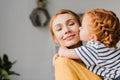 Girl kissing her mother in cheek Royalty Free Stock Photo