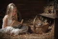 Girl with a kitten on hay Royalty Free Stock Photo