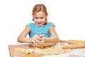 Girl kneads and press dough for dumplings isolated Royalty Free Stock Photo