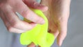 Girl kneads the yellow mucus. A fun sensory activity