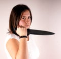 Girl with knife Royalty Free Stock Photo