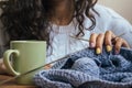 The girl, knitting and green cup Royalty Free Stock Photo