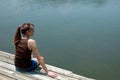 Girl at lake on dock Royalty Free Stock Photo