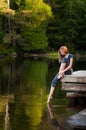 Girl on a lakeside dock