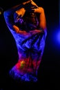 Girl with landscape bodyart in blacklight Royalty Free Stock Photo