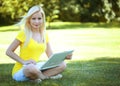 Girl with laptop. Blonde beautiful young woman Royalty Free Stock Photo