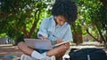 Girl laptop making notes in notepad sitting nature close up. Student studying Royalty Free Stock Photo