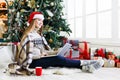 Young woman online on laptop at christmas interior Royalty Free Stock Photo