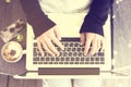 Girl with laptop, smartphone and cappuccino Royalty Free Stock Photo